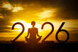 © Creativa Images - Woman Meditating for a Peaceful 2026 at Sunset