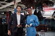 © tigercat_lpg - Portrait of professional partner, Latino male manager, and Black female mechanic smile, cheerful, cooperate service claim business, car fix warranty and maintenance at auto garage station industry.