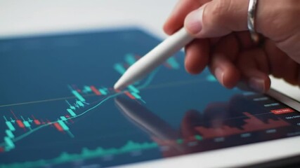 Poster - Stock Market Analysis Hand Using Stylus on Digital Tablet Displaying Financial Graph in Red and Green Colors on Blue