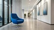 ©  Sarimo graFX - Modern office hallway with a blue chair and artwork on the wall
