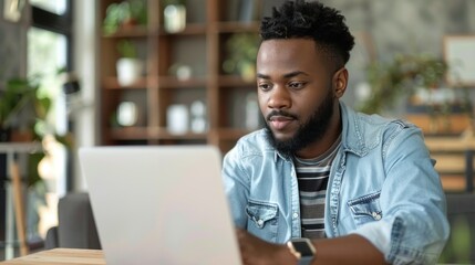 Poster - Young man focused on laptop stock photo --ar 16:9 --raw --v 6 Job ID: 9333430e-858b-4f50-959d-e4158ebef2ea