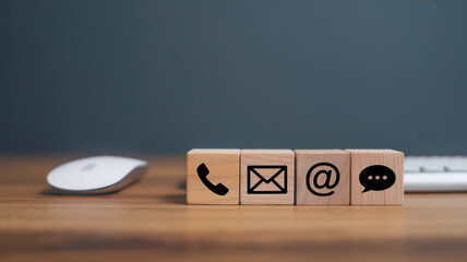 Wooden cubes with communication icons contact phone