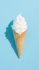 Poster - Vanilla ice cream cone with shadow on a light blue background in a studio shot, minimal style
