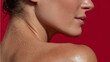 © Marut - Close up of smooth skin with water droplets on shoulder and neck against red background showing wellness and hydration care for healthy appearance and beauty