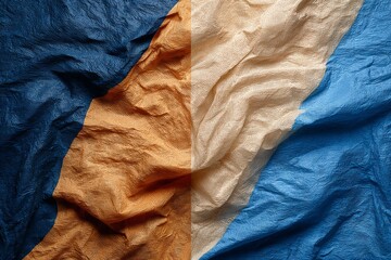 Leinwandbilder - Fabric textures with blue, orange, and cream colors create an abstract visual composition in natural light