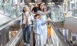 © Art_Photo - Asian family traveler on airport escalator, grandmother smiling with grandson, mother beside them on travel day, family package tour, airline service and health travel insurance, hotel accommodation
