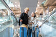 © Art_Photo - Senior asian traveler couple smiling at airport with suitcases show excitement before travel, retirement lifestyle, planning international journey, travel insurance for elderly, tour and global trip