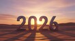 © rakhul - Large metallic numbers representing the year 2026 stand in a desert landscape at sunset.