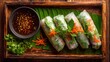 © Sky Layer - Vietnamese fresh spring rolls with dipping sauce on banana leaf tray