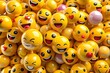 © MSTHIRAMONY - A vibrant pile of cheerful yellow emoji faces expressing various happy emotions and smiles