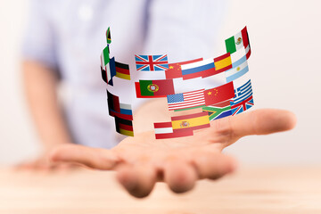 Poster - Image of diverse flags held in a hand, symbolizing global connections and international business.