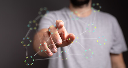Poster - Close-up of a man's hand interacting with a digital network, showcasing connectivity and technology.