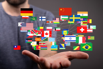 Poster - Image of a person holding a network of interconnected world flags, representing global connections and international relations.