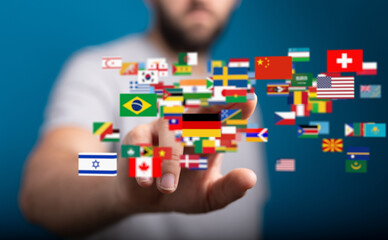 Poster - Person touching digital world flags, representing global communication and international business.