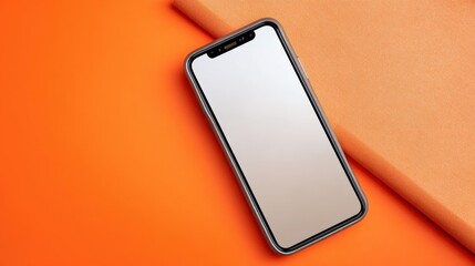 Poster - A sleek smartphone on an orange background, paired with a textured surface, emphasizing modern technology and vibrant colors.