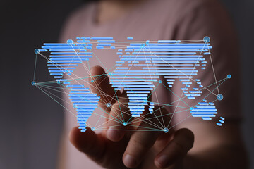 Poster - Hand interacting with a digital world map, showcasing global connectivity and networking.
