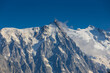 © Yuliia - Chamonix valley landscape of a prominent rocky towering mountain peak Aiguille du Midi in French Alps. Chamonix-Montblanc area, Tour du Montblanc beautiful landscape Aiguille du Midi summit, France