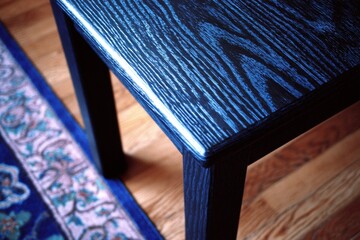 Poster - Beautifully crafted dark wood table resting on an intricate rug in a cozy living space during daylight hours