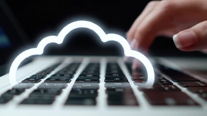 Poster - Typing on Laptop Keyboard with Cloud Computing Symbol Overlay on Black Background