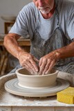 Potter making ceramic bowl on pottery wheel