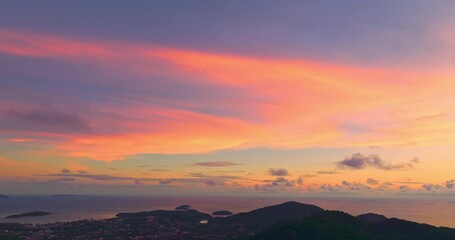 Wall Mural - aerial view stunning sunrise above archipelago Phuket. beautiful moving cloud in vivid sky at sunrise. 4k stock footage video in travel concept. amazing colorful clouds over the horizon