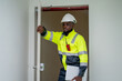 © NewSaetiew - Engineers step onto the rooftop to inspect the solar panel installation.