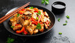 © hardvicore - Stir fry noodles with chicken slices, red paprika, mushrooms, soy sauce and sesame seeds. Asian dish