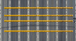 © RIKO - Urban Roadscape With Yellow Speed Bumps And White Lines From Above View