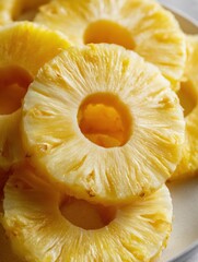 Poster - Sliced Pineapple Rings Stacked in a Spiral With Soft Shadows and a Top Layout Against a Simple Background