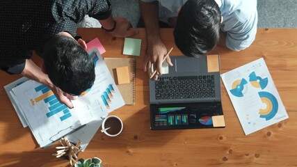 Poster - Top aerial view of business team working together to analysis data by using laptop on meeting table. Cooperative start up group discussing and brainstorming plan while looking at graph. Convocation.
