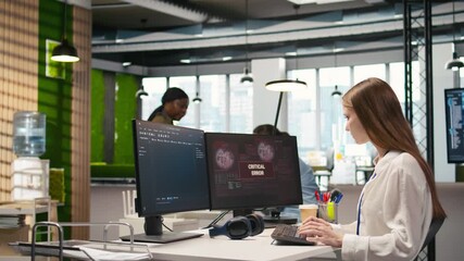 Poster - Young inexperienced developer in office struggling to fix critical error warning popup. Intern troubleshooting error notification on computer screen interrupting workflow, camera A
