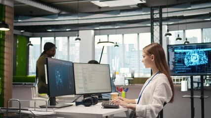 Fototapete - Female engineer using AI LLM chatbot, optimizing company systems performance. System administrator uses artificial intelligence assistant to convert manual workflows into automated scripts, camera A