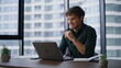 © stockbusters - Creative startuper working online at laptop drinking coffee in workplace closeup