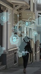 Poster - Bitcoin icons over world map against read view of a woman walking on the street