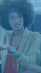 Poster - Animation of statistical, stock market data processing over two diverse women discussing at office