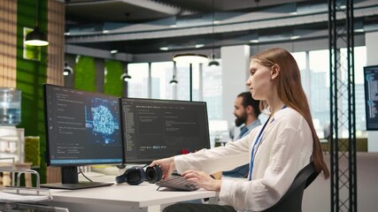 Poster - Young female programmer in office reviewing AI system metrics, listening music, monitoring performance dashboards. Junior dev wearing headphones tuning neural networks using tools on PC, camera A