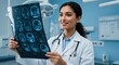 © MT - Confident female doctor examining a brain MRI scan in a modern hospital. Young woman neurosurgeon analyzing patient results.