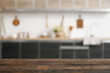 © Pixel-Shot - Empty table against blurred kitchen interior