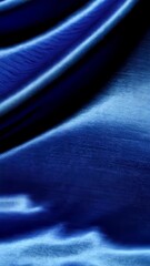 Poster - Close up of velvety rich blue fabric with gradient and shimmering light showing subtle textures and soft wavy folds detail
