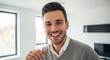 © Hyejin Kang - Headshot portrait of young man posing indoors with healthy toothy smile at relocation day.