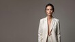 © Sergey - A Confident Woman in a Stylish Cream Suit, Embracing Elegance and Modern Fashion Aesthetics with a Poised Expression Against a Neutral Background