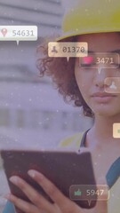 Poster - Construction worker using tablet with social media notifications animation overlaid