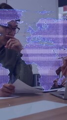 Poster - World map animation over thoughtful person working with laptop and documents