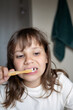 © Cavan - Happy child brushing teeth. Morning and evening routine.