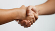 © Eva Corbella - Close-up photograph of a handshake between two people, symbolizing agreement, cooperation, or a successful deal.