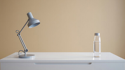 Poster - A gray desk lamp and a glass bottle of water on a white desk against a beige colored wall backdrop