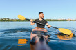 © Serhii - Kayaker paddling on river in sunny day taking selfie