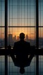 © Adrian - Businessman silhouette looking at city skyline at sunset office leadership success vision
