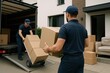 © Rawpixel.com - Professional movers handling boxes.