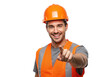 © Over View - A smiling construction worker in a hard hat and safety vest points forward confidently, isolated on transparent background